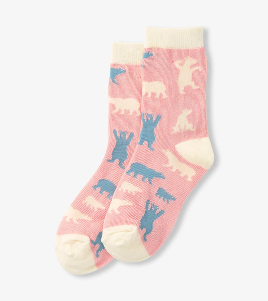 Pink crew socks featuring polar bear patterns in blue and cream, suitable for kids.