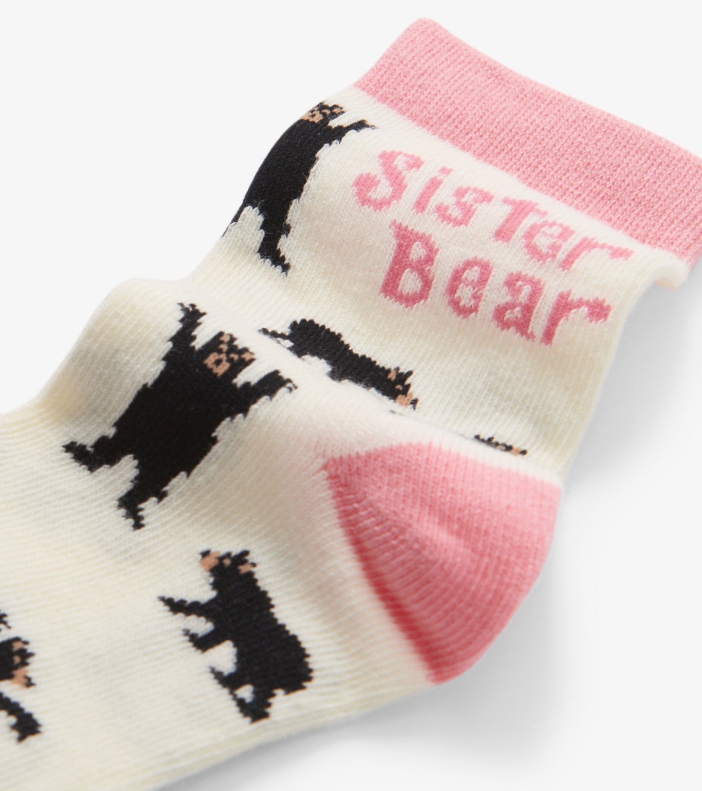 Cream crew socks featuring black bear patterns and pink accents, ideal for girls aged 2-7.