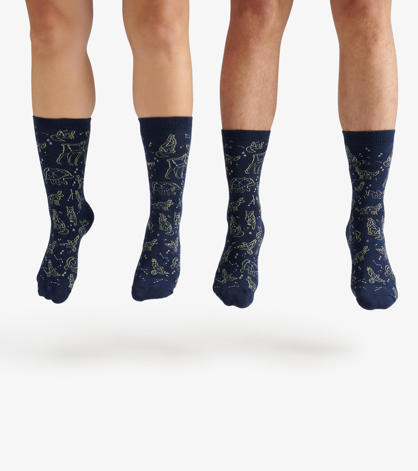 Navy crew socks featuring animal constellations in a light green pattern, suitable for casual wear.