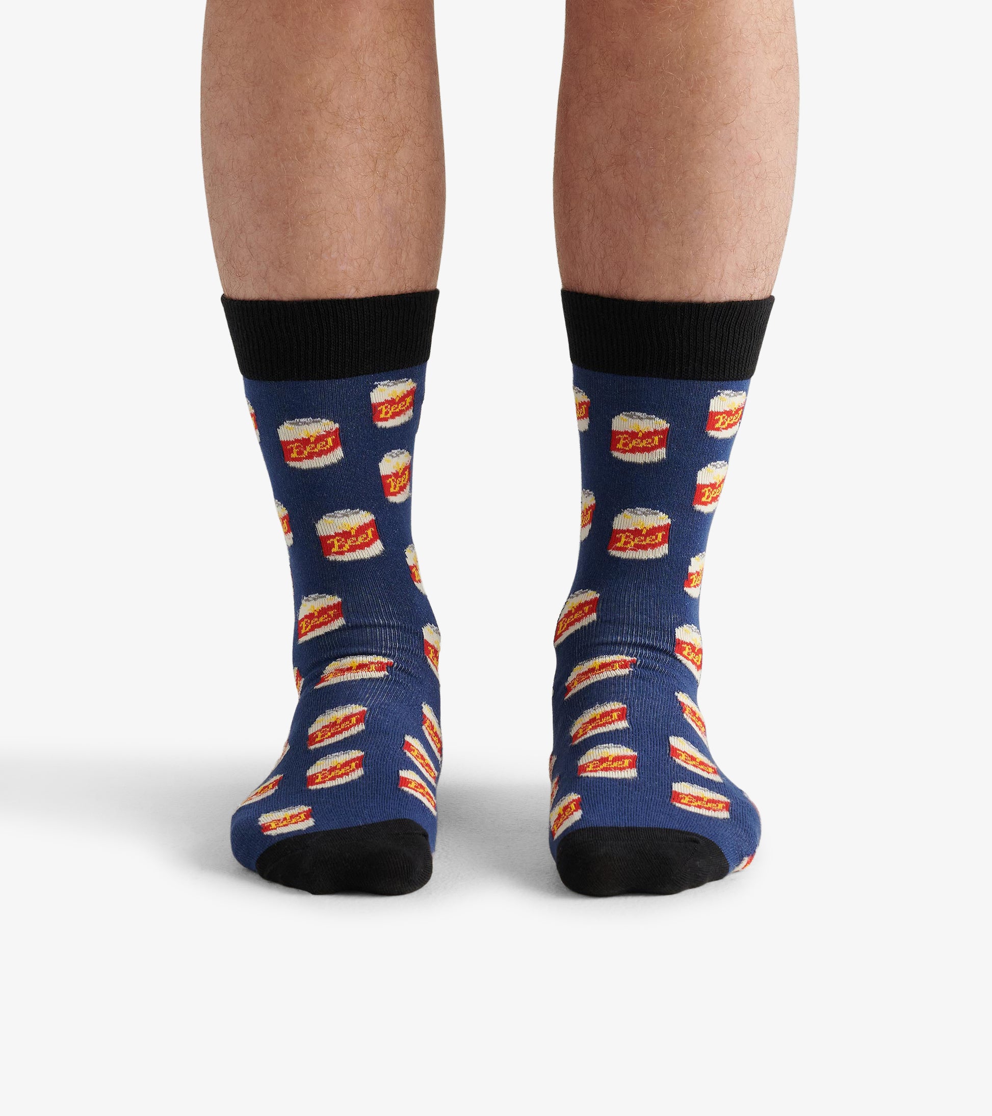 Blue crew socks featuring a playful beer can pattern, with black cuffs and toe accents. One size fits most.