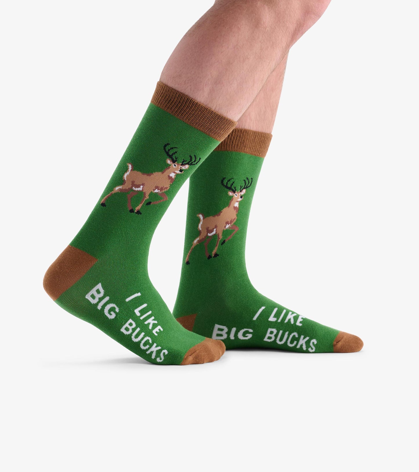 Green crew socks featuring a deer graphic and the text "I Like Big Bucks," with brown accents at the top and toe.