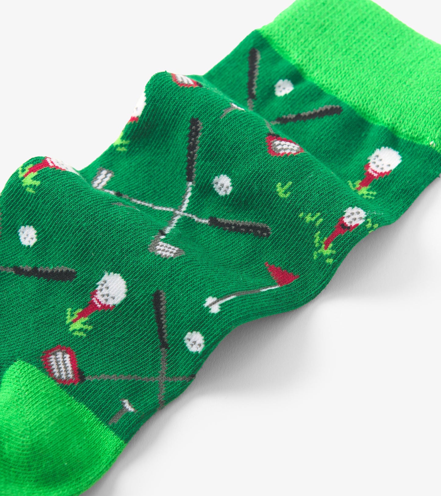 Green crew socks featuring a playful pattern of golf clubs and balls, made from soft, comfortable material.