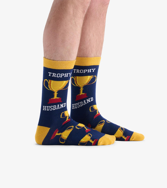 Navy crew socks featuring trophy and "HUSBAND" text, with yellow accents and a playful design. One size fits most.