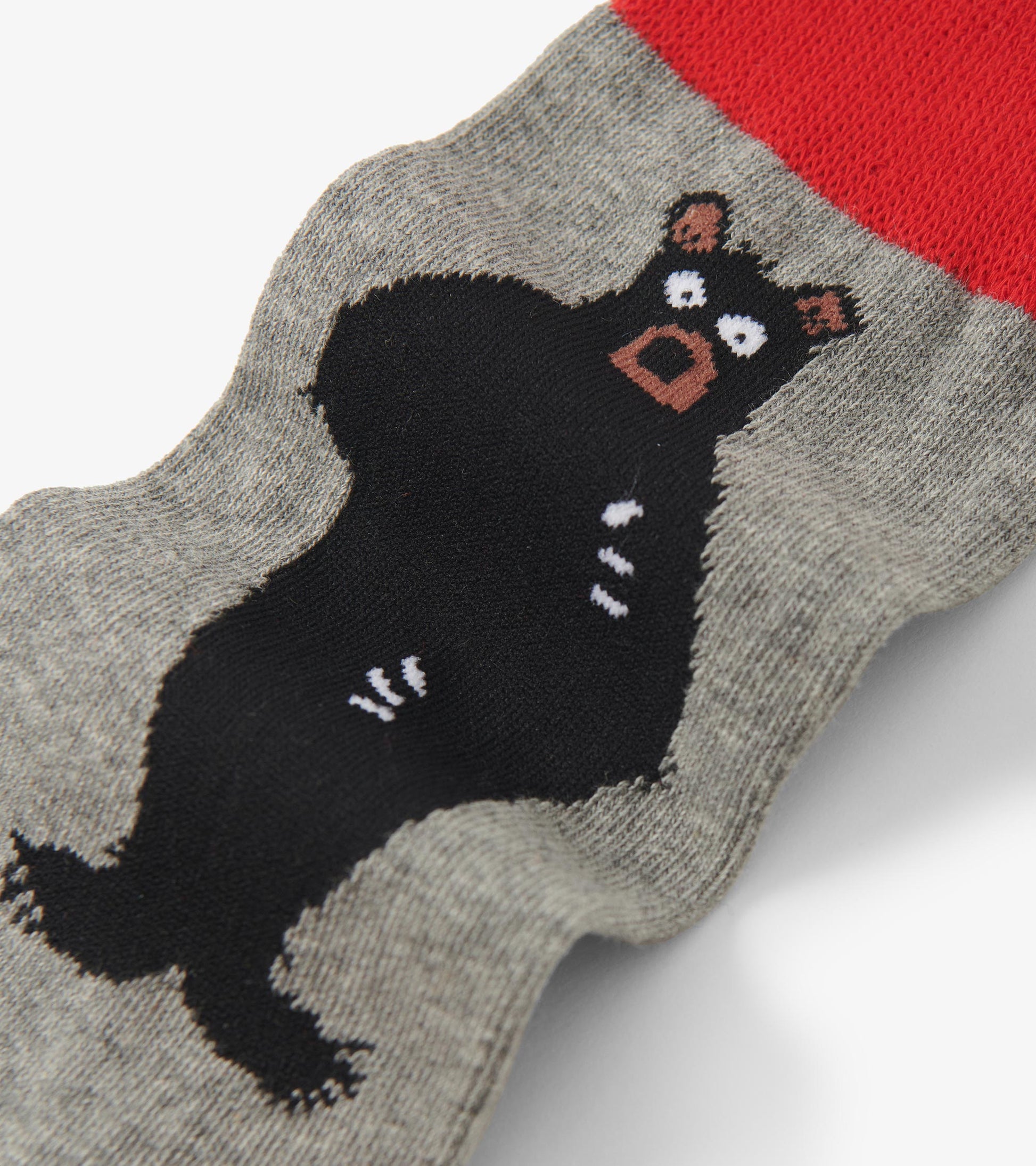 Gray crew sock featuring a playful black bear design with a red cuff. Suitable for casual wear.