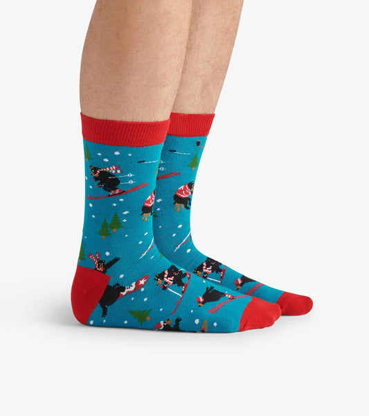 Turquoise crew socks with red accents, featuring playful skiing bears and snowflakes, perfect for winter wear.