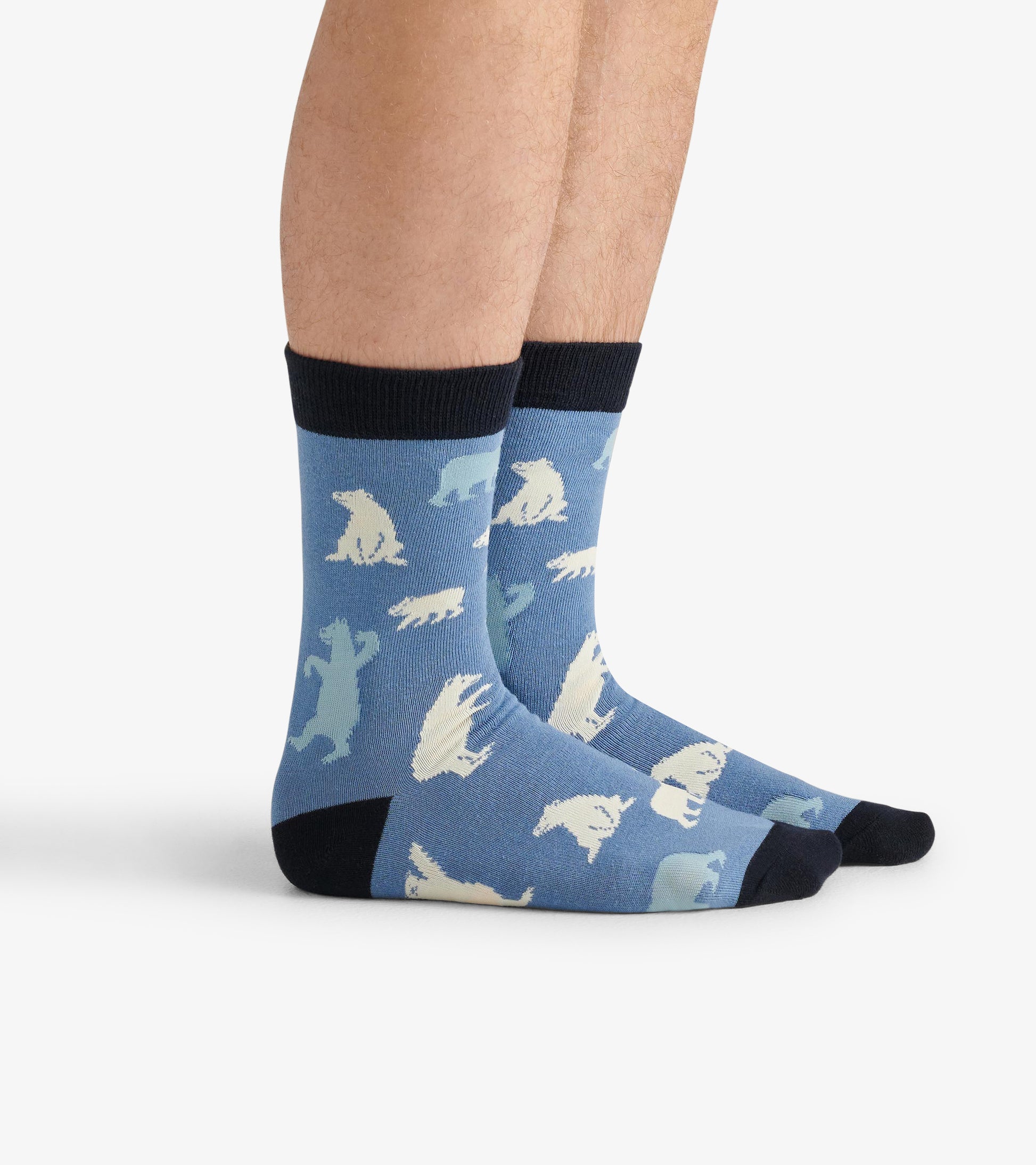 Blue crew socks featuring polar bear patterns, with a dark cuff and toe, suitable for casual wear.