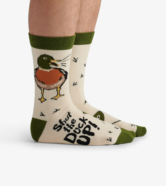 Beige crew socks featuring a colorful duck design and playful text, with green accents at the cuff and toe.