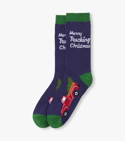 Men's crew socks in dark purple with a red truck hauling a tree and green accents, featuring "Merry Trucking Christmas" text.