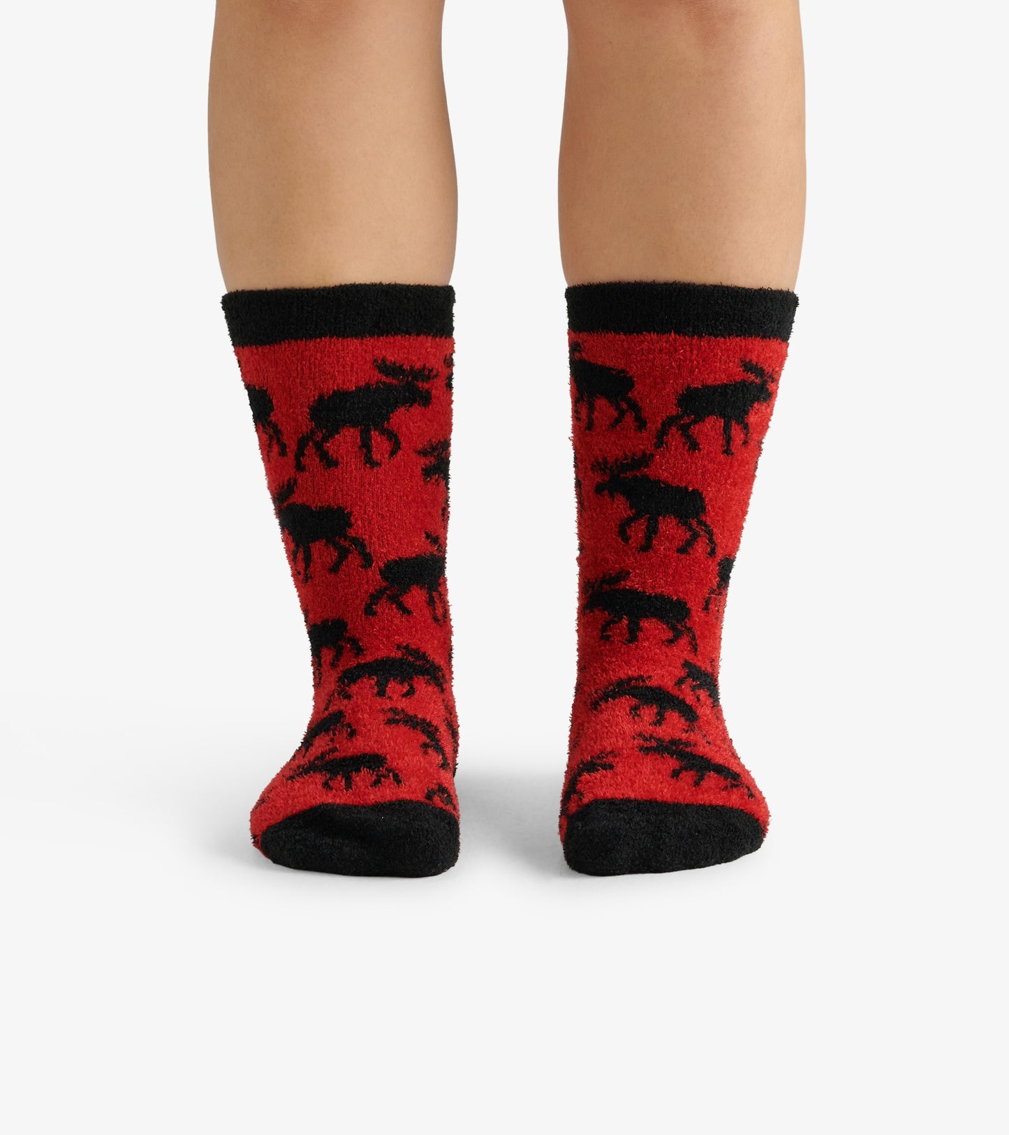 Red fuzzy socks featuring a black moose pattern and black cuffs, designed for warmth and comfort.