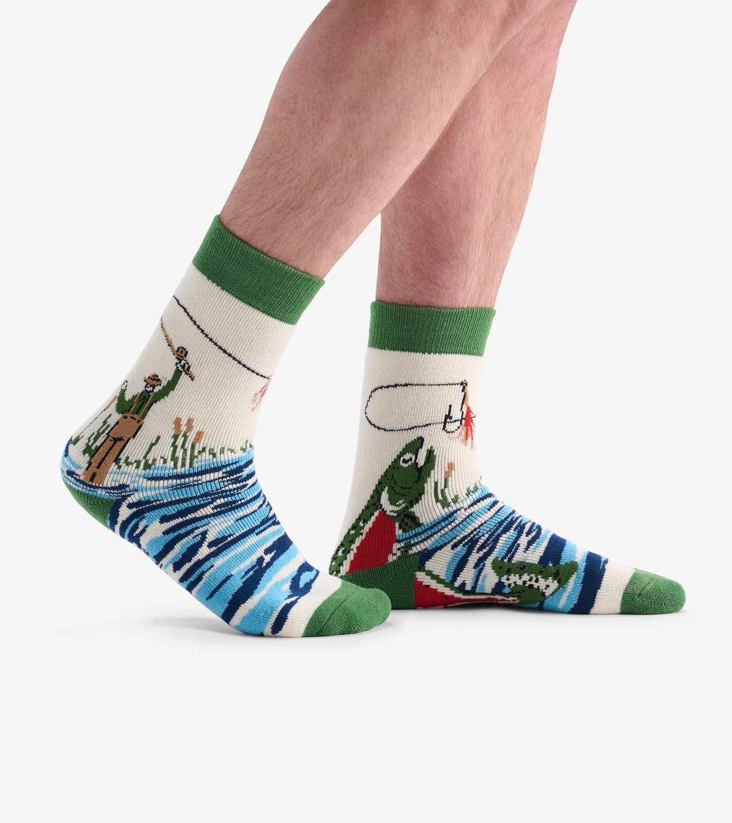 Cozy adult socks featuring a fishing theme with green cuffs, depicting fish and a fisherman against a cream background.