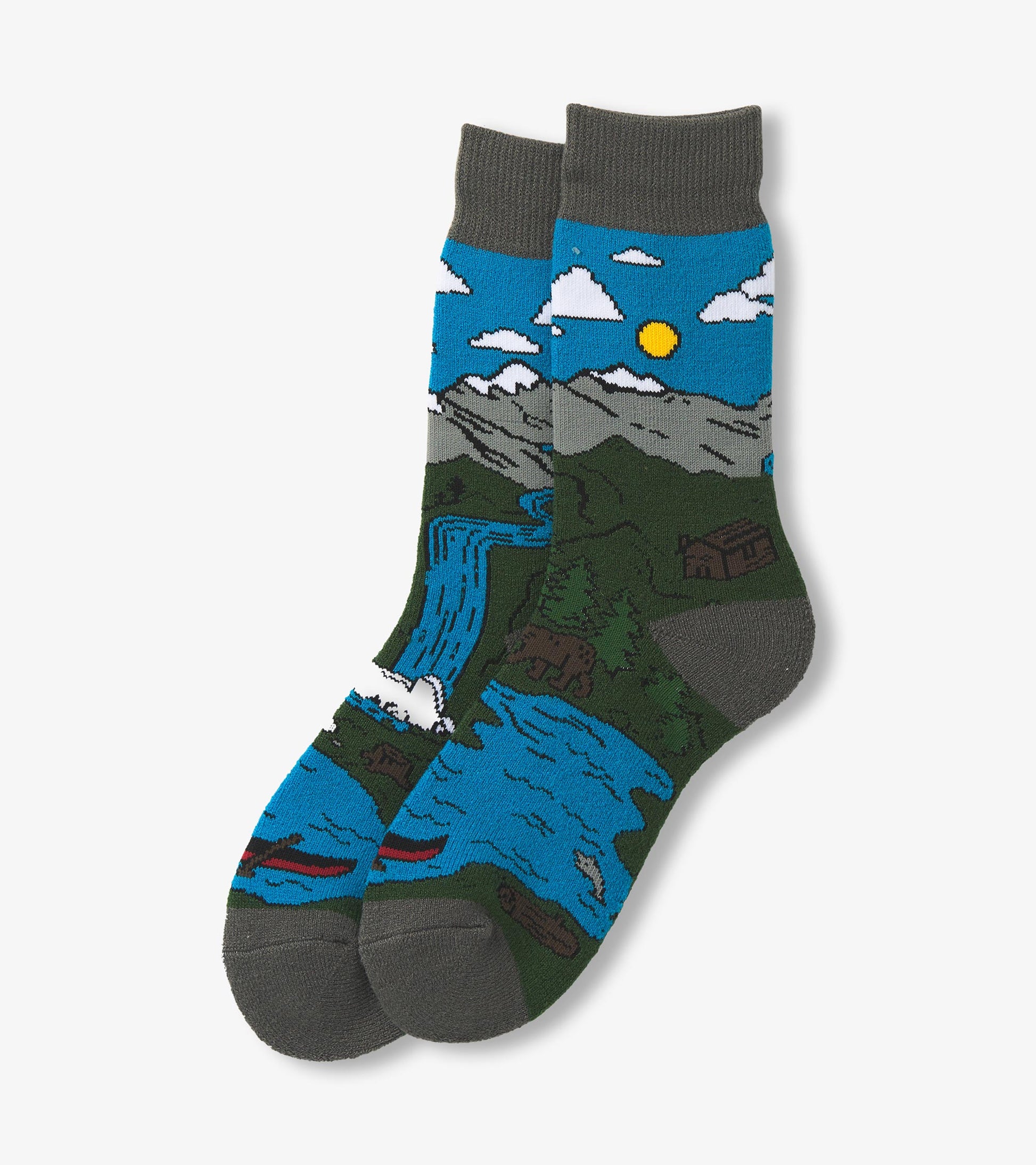 Cozy socks featuring a colorful mountain and river scene with a blue sky, clouds, and sun, in a comfortable knit design.