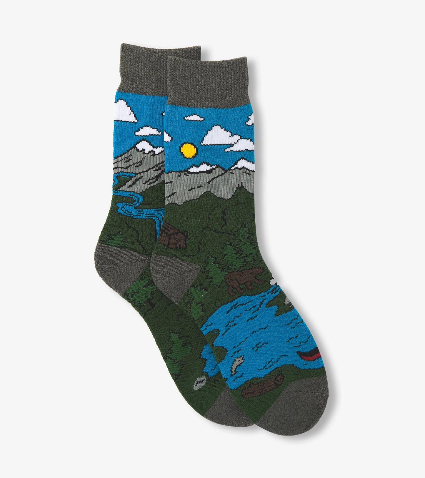 Cozy socks featuring a colorful mountain and river scene with a blue sky, sun, and greenery. One size fits all.