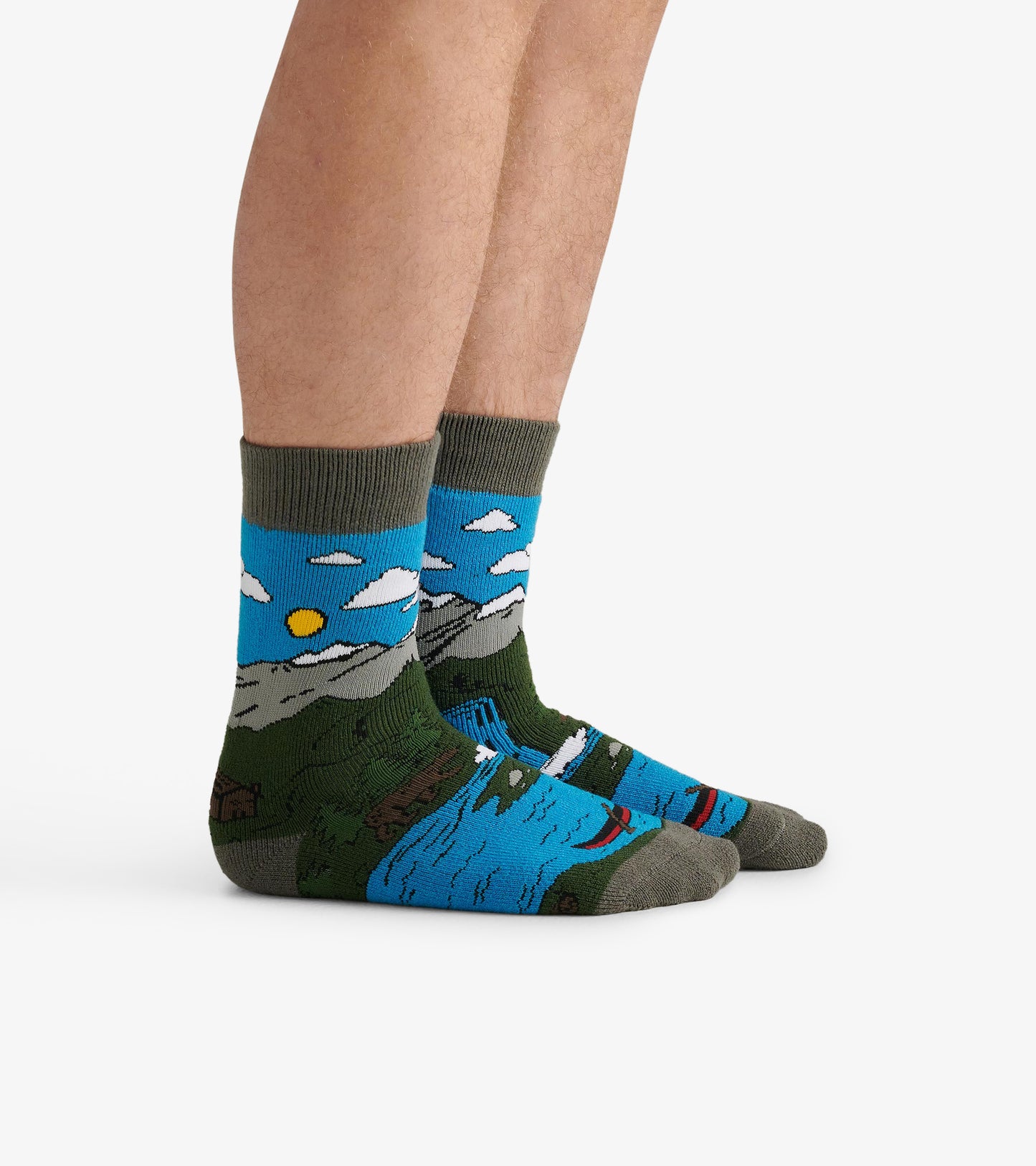Cozy men's socks featuring a scenic mountain and lake design in blue, green, and gray colors. One size fits all.