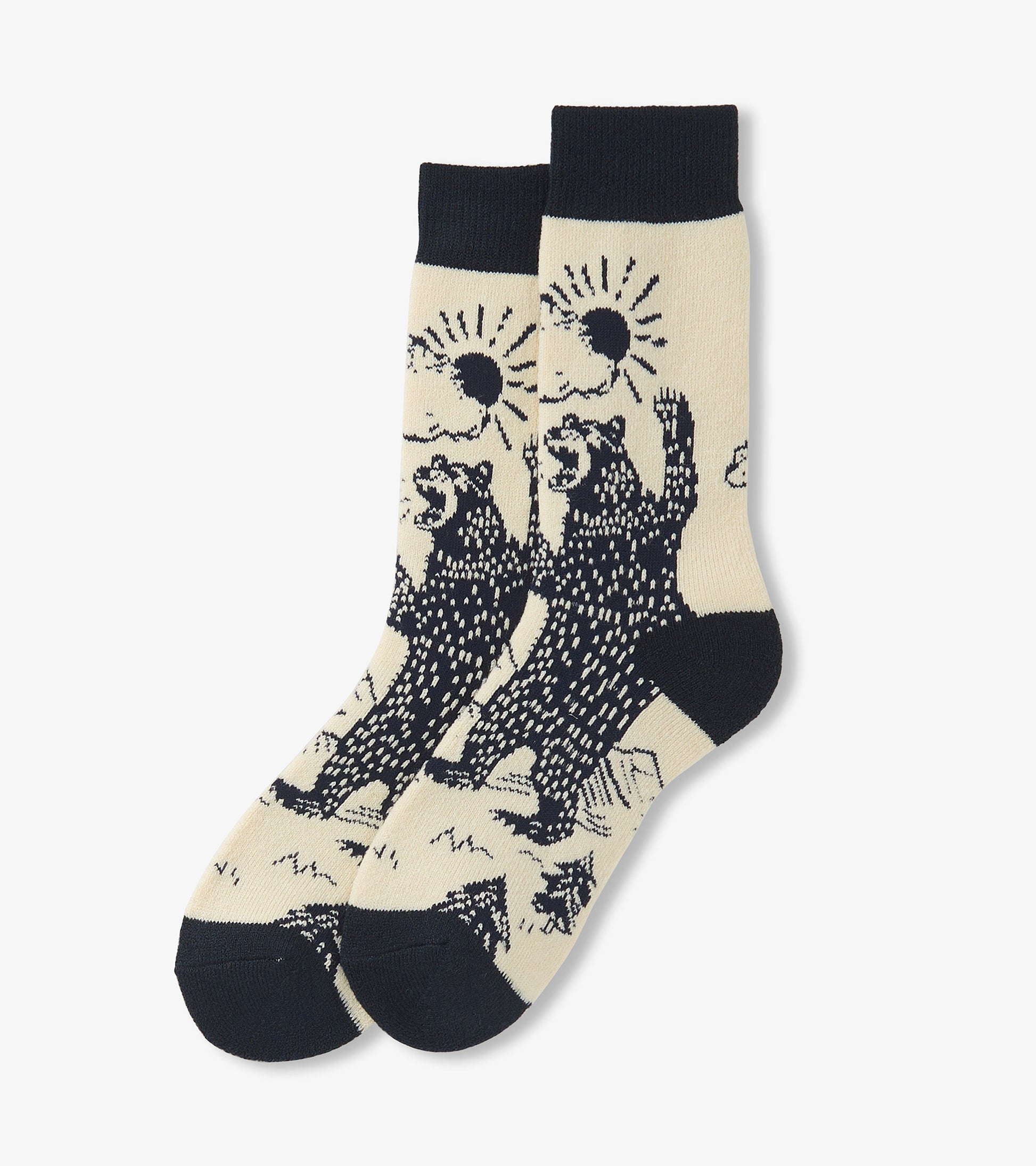 Beige cozy socks featuring black grizzly bears and sun designs, with a dark navy cuff and toe. One size fits all.