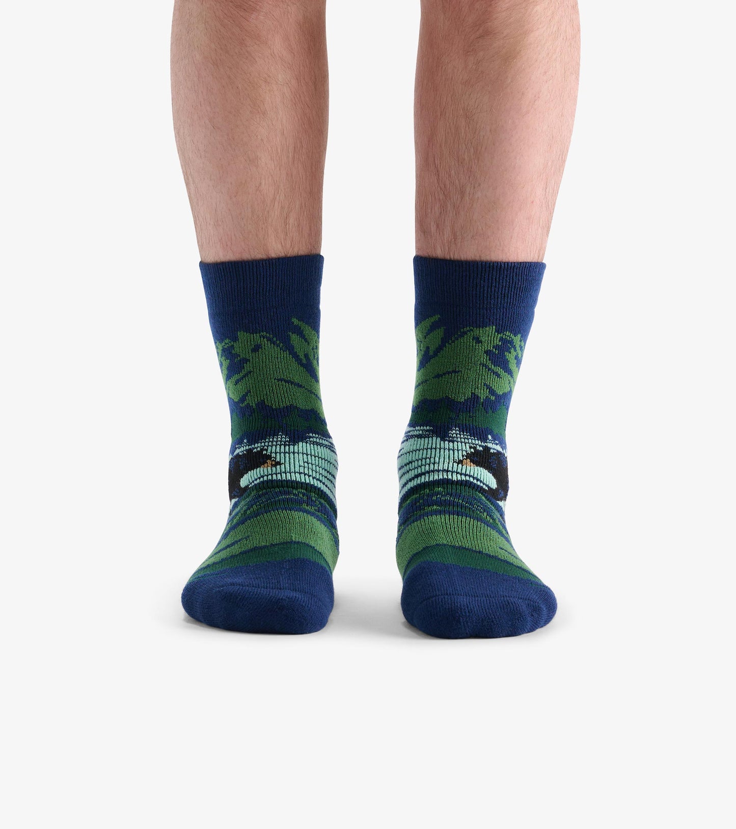 Cozy socks featuring a bear design with green and blue stripes, suitable for casual wear. One size fits most.