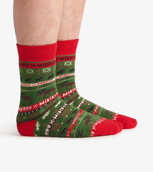 Green and red cozy socks featuring a festive moose pattern and holiday text, suitable for casual wear.