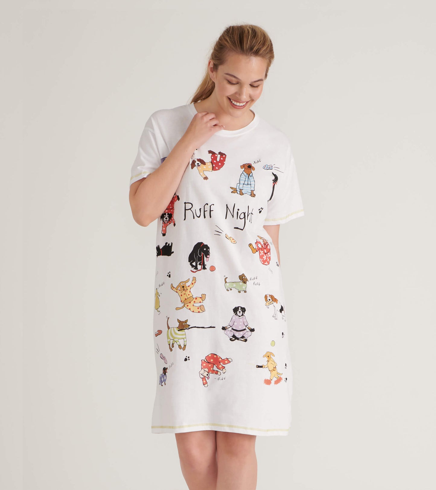 White sleepshirt featuring playful dog illustrations and the text "Ruff Night," with a relaxed fit and short sleeves.