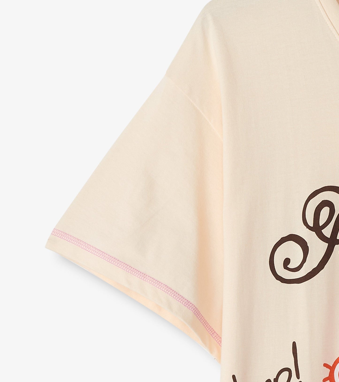 Light peach sleepshirt with short sleeves and playful text design, featuring a relaxed fit and soft fabric.