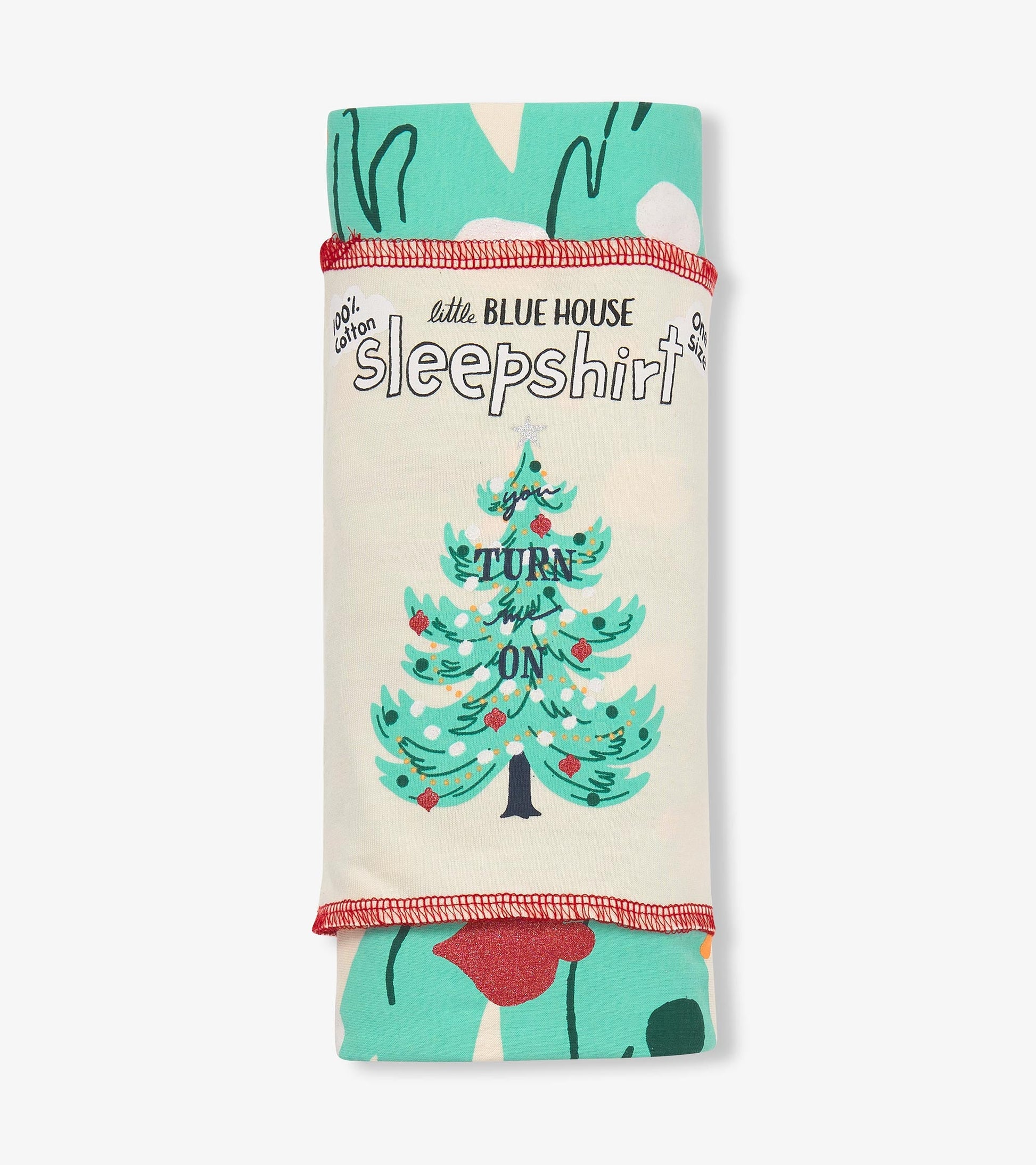 Cotton sleepshirt featuring a festive tree design with the text "Turn Me On," in teal and cream colors, folded neatly.
