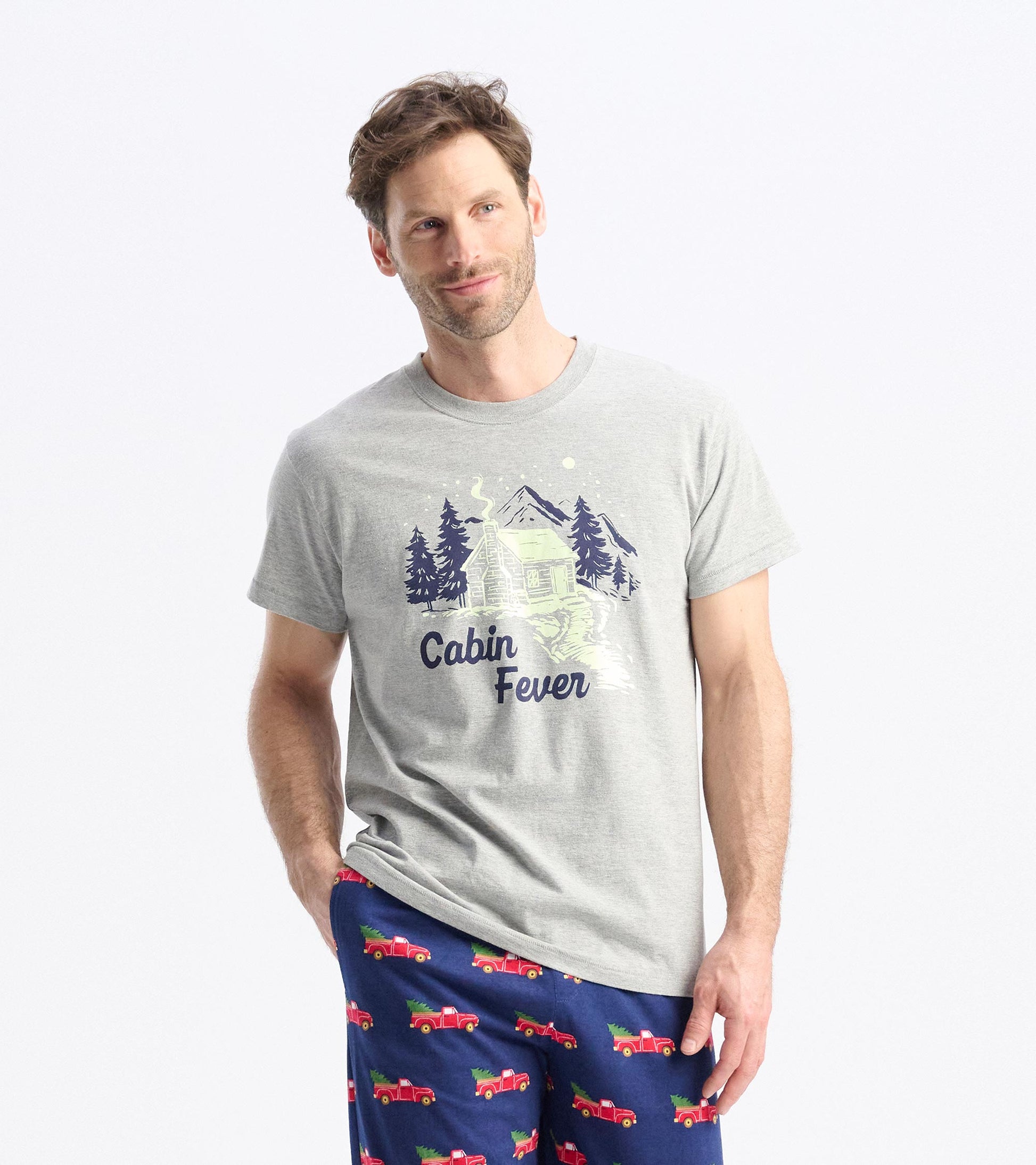 Gray short-sleeve t-shirt featuring a cabin graphic and "Cabin Fever" text, ideal for casual winter wear.