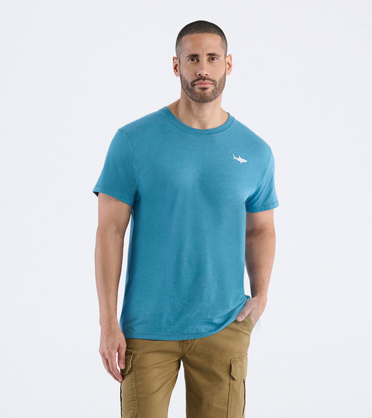 Men's short-sleeve tee in teal with a shark graphic on the chest, made from soft cotton blend fabric.