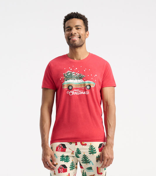 Red short-sleeve t-shirt featuring a graphic of a car with a Christmas tree and snowflakes.