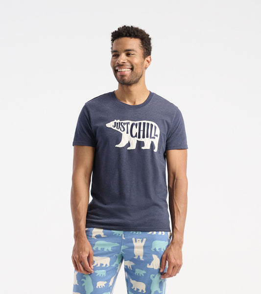 Navy blue short-sleeve t-shirt featuring a white bear graphic and "JUST CHILL" text, worn with patterned pajama pants.