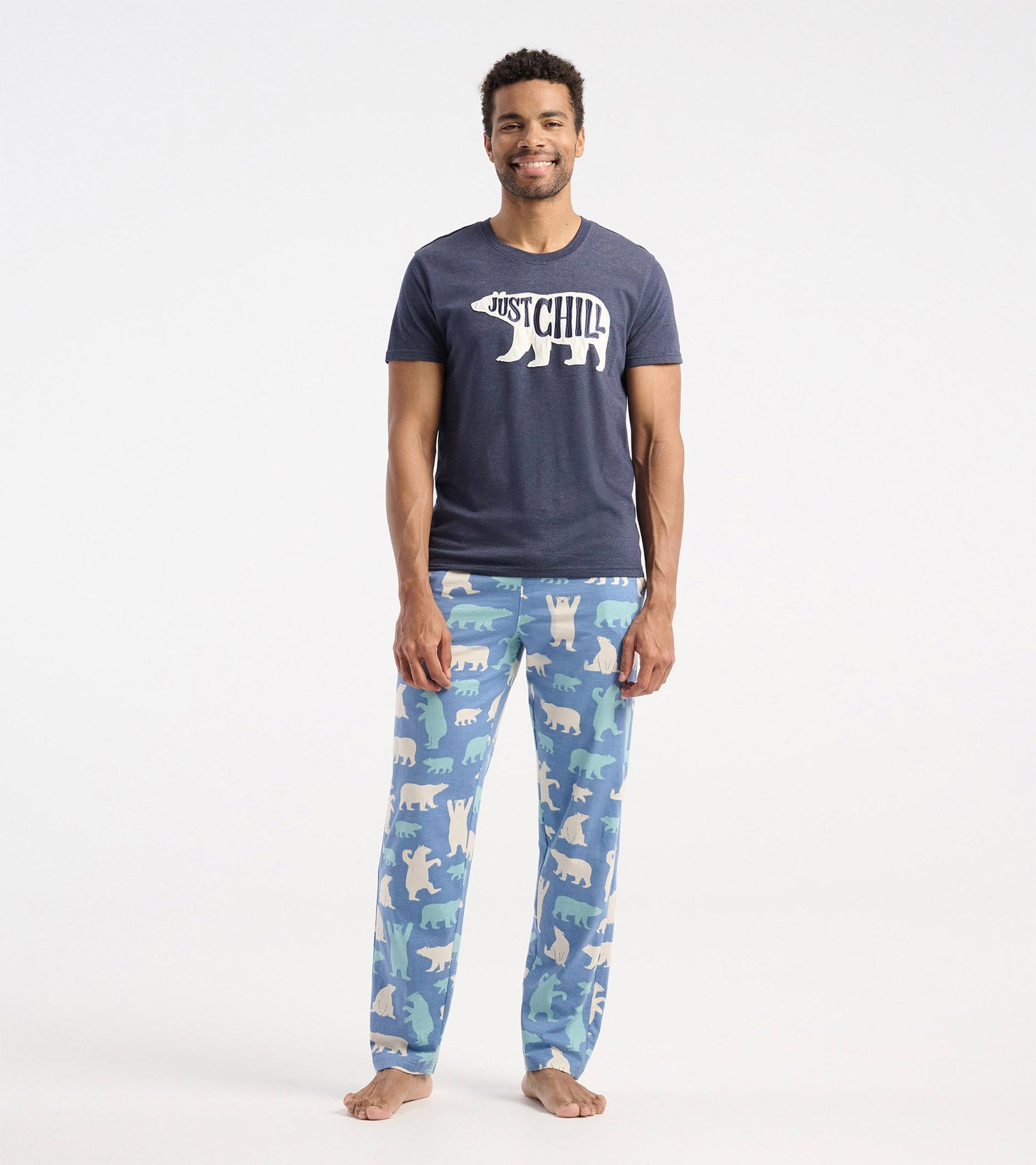 Navy blue short-sleeve t-shirt with "Just Chill" bear graphic, paired with patterned pajama pants featuring polar bears.