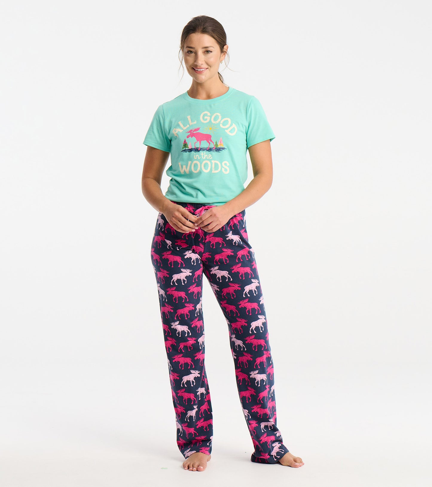 Mint green pajama t-shirt with a graphic design, paired with navy pants featuring colorful moose patterns.