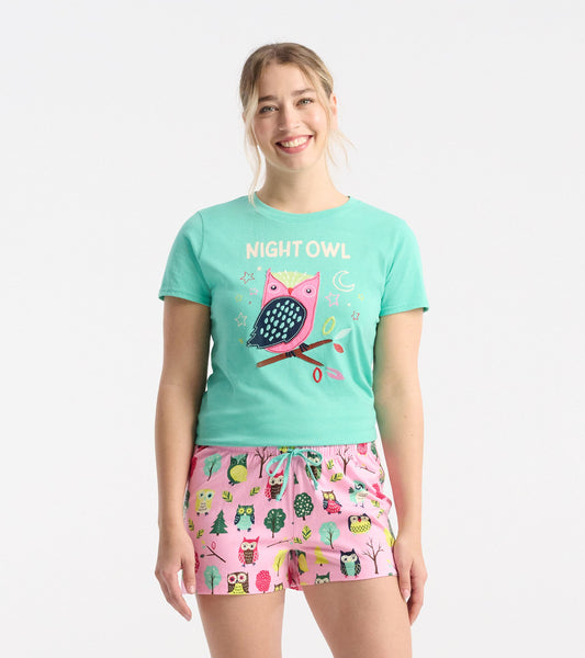 Mint green pajama tee featuring a colorful owl graphic, paired with pink shorts adorned with various owl and tree patterns.