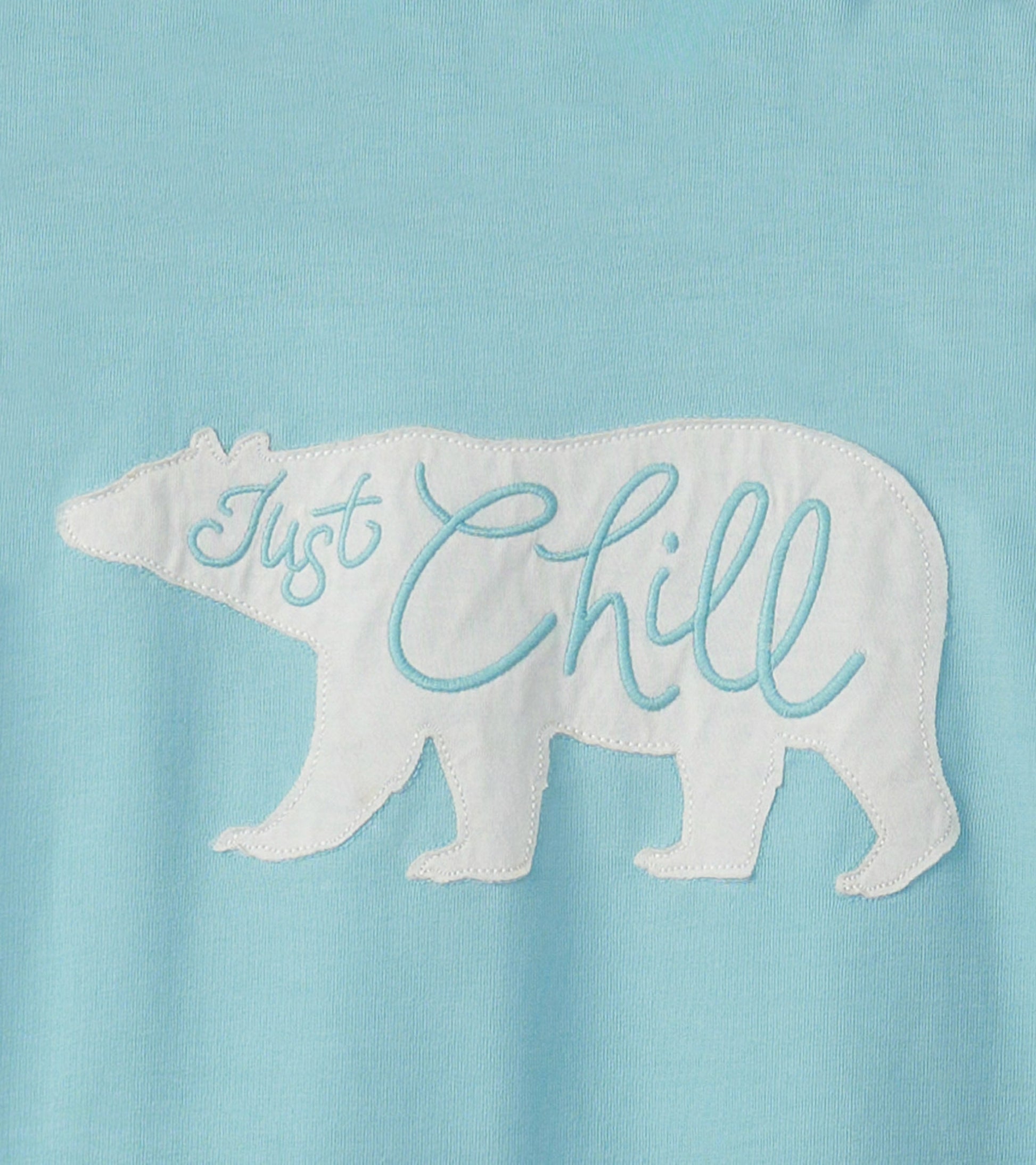 Light blue pajama tee featuring a white bear silhouette with "Just Chill" embroidered in light blue.
