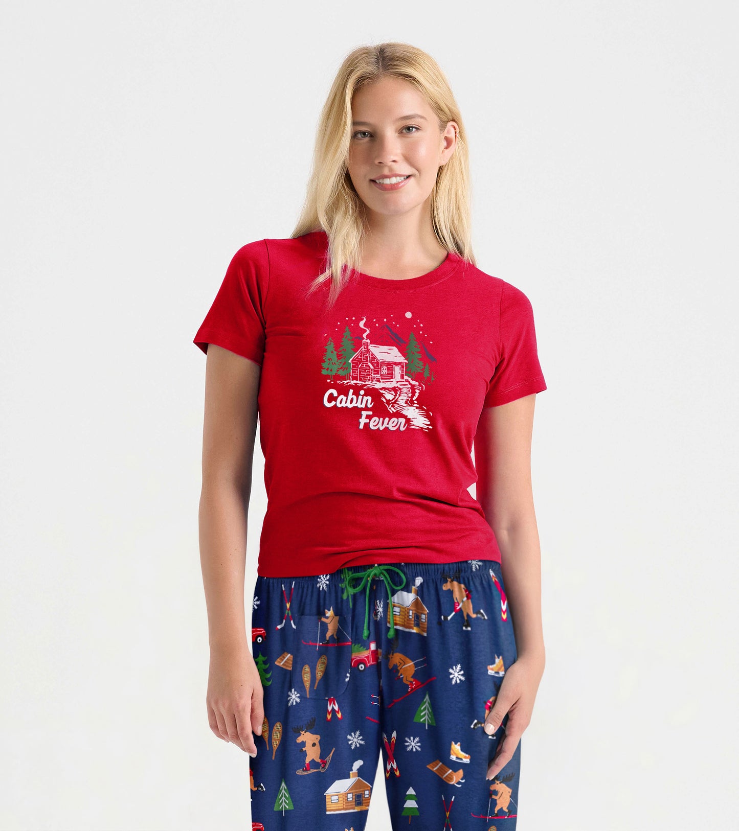 Red short-sleeve pajama t-shirt featuring a cabin graphic and "Cabin Fever" text, perfect for winter lounging.