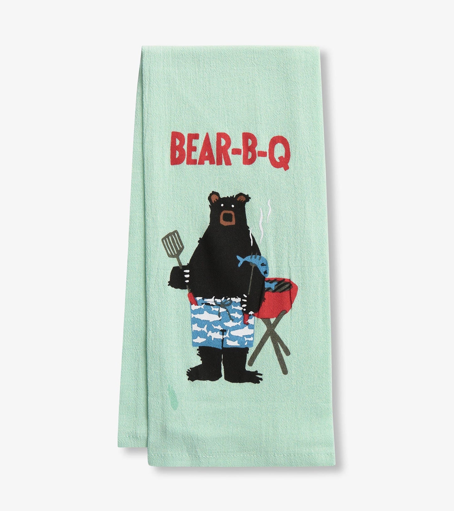 Mint green tea towel featuring a bear in swim trunks holding a spatula and fish, with a grill in the background.