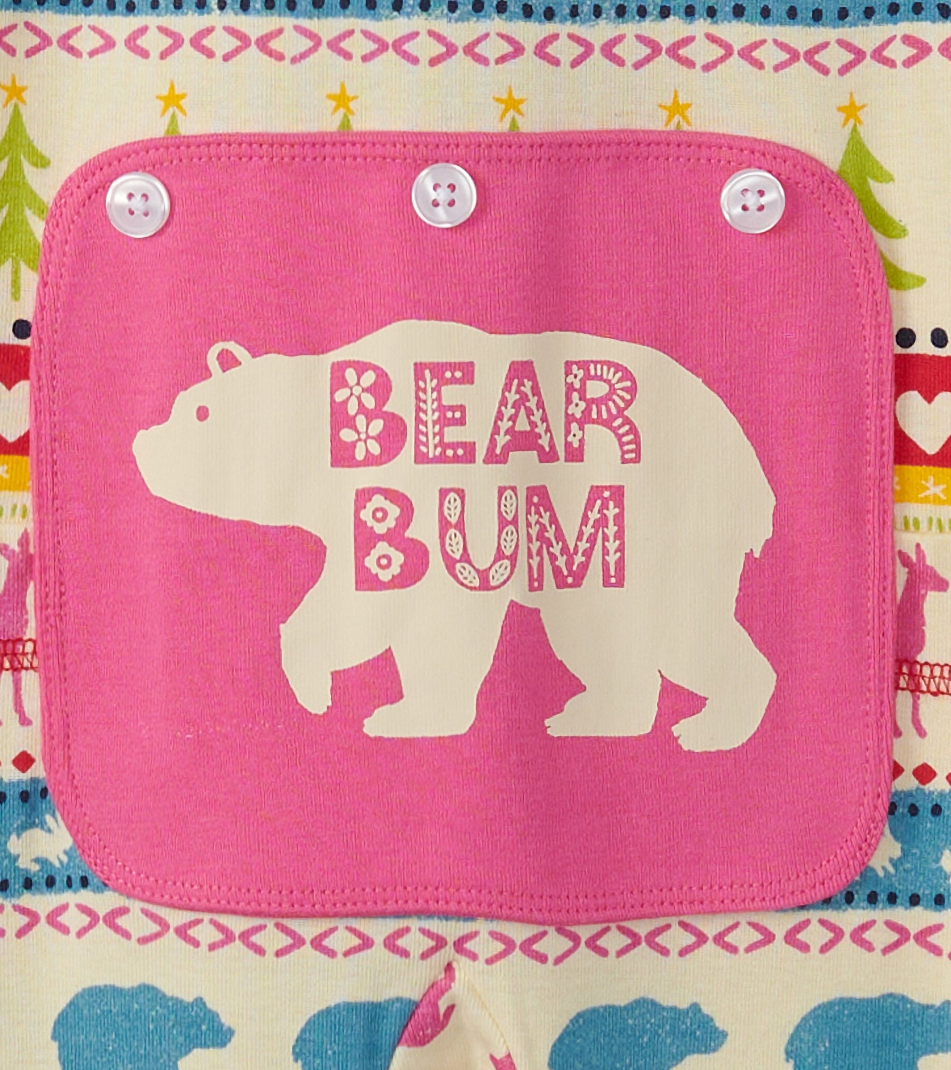 Cream onesie featuring a pink bear-themed patch with "BEAR BUM" text, decorated with a colorful Fair Isle pattern.