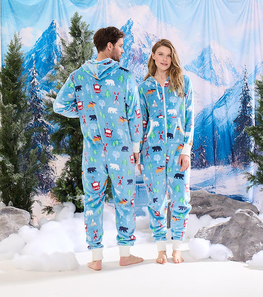 Light blue fleece jumpsuit with winter-themed patterns, featuring a hood and cuffed sleeves, shown on two models.