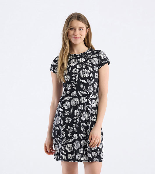 Black t-shirt dress featuring a white floral pattern, short sleeves, and a fitted silhouette.
