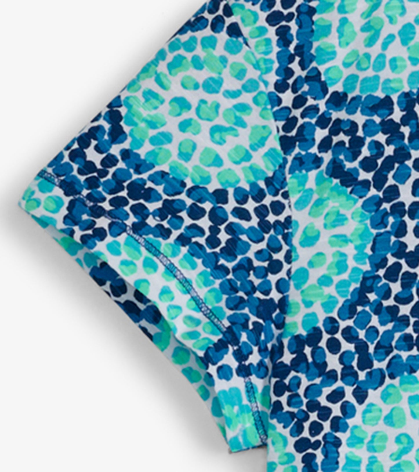 Crew neck t-shirt dress featuring a blue and green abstract pattern, short sleeves, and a relaxed fit.