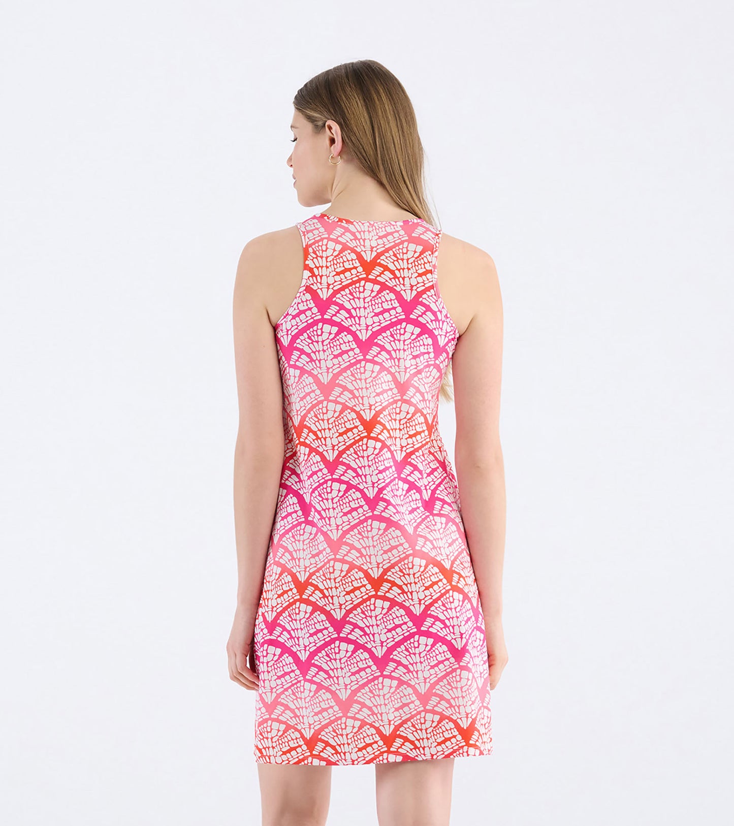 Back view of a sleeveless summer dress featuring a vibrant pink and orange leaf pattern.