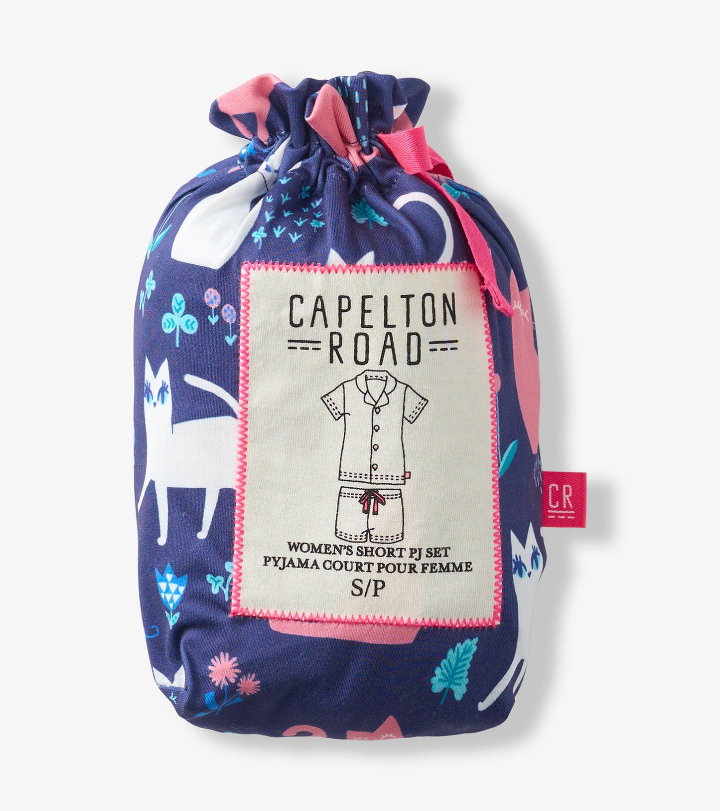 Folded navy pajama set bag with pink trim and cat print, labeled women's short PJ set.