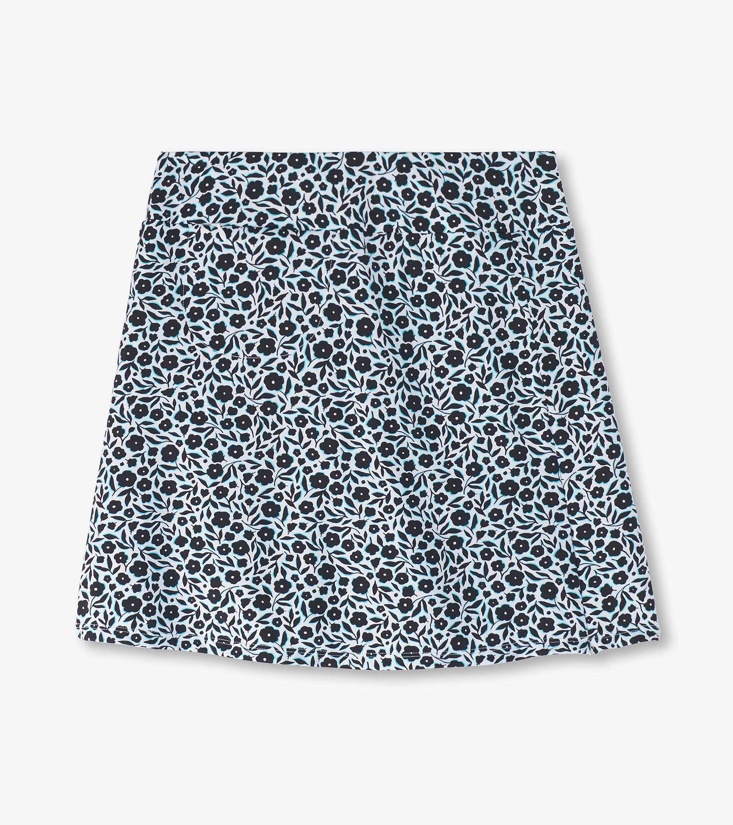 Floral-patterned skort in black, white, and light blue, featuring a fitted waistband and a flared shape.