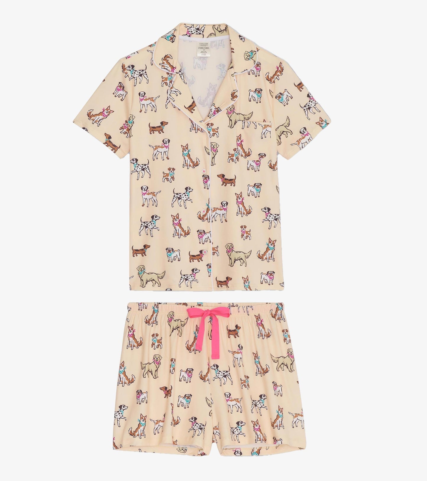 Short pajama set featuring a light beige fabric with colorful dog prints and a pink drawstring on the shorts.