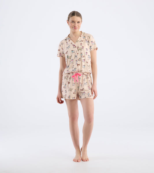 Short pajama set featuring a light pink color with a playful dog print and a drawstring waist.