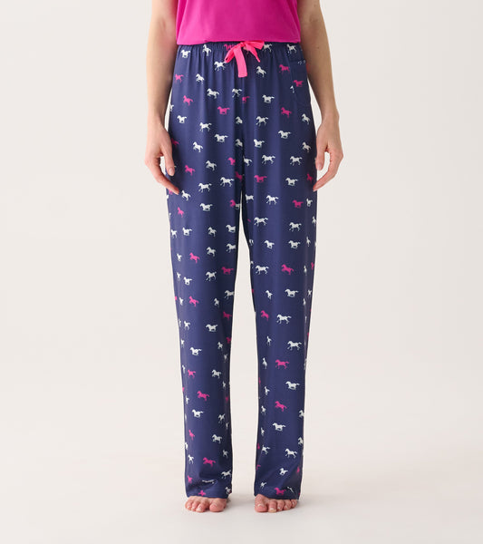 Navy pajama pants featuring a playful horse pattern in pink and white, with an elastic waistband and drawstring.