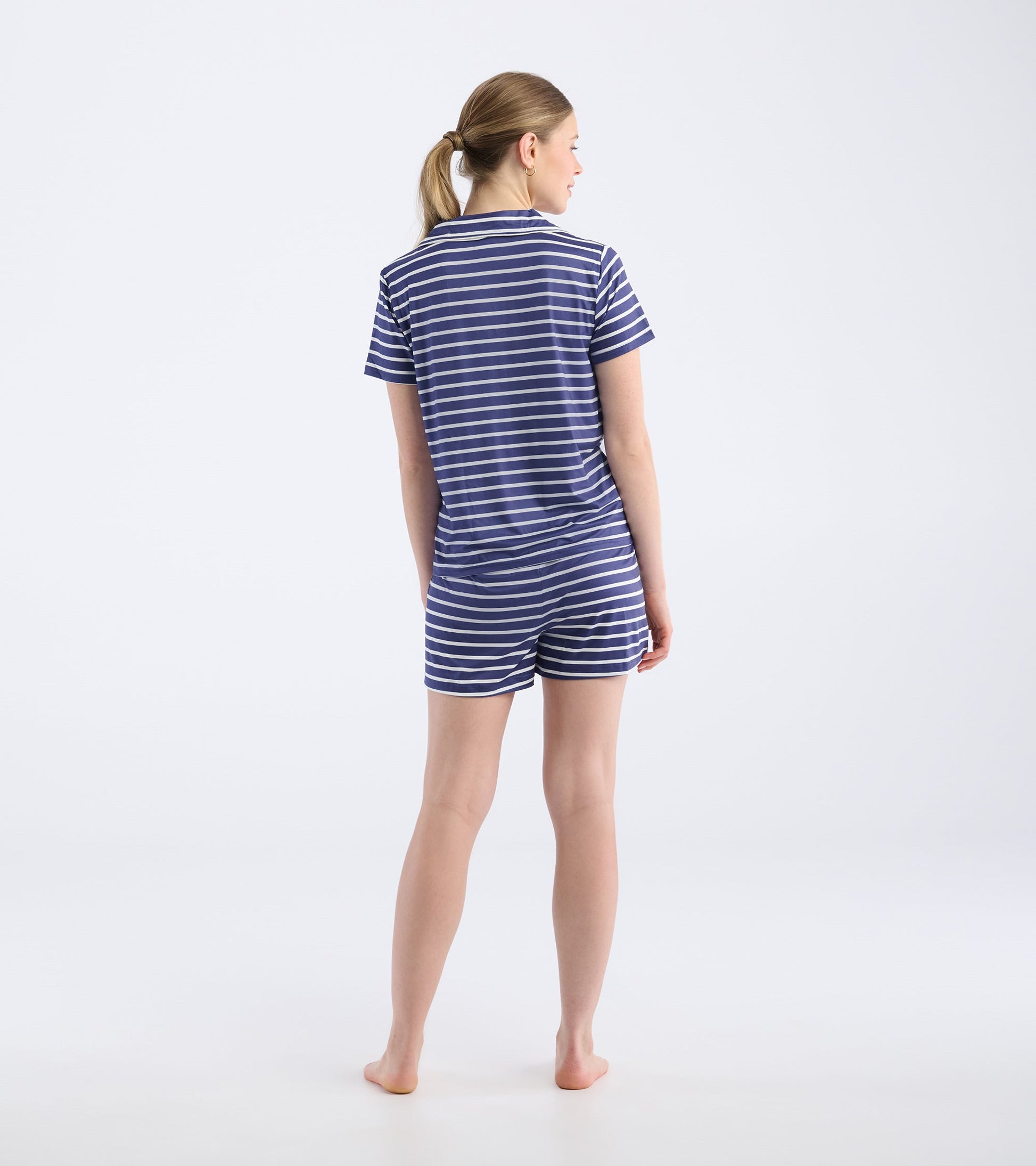 Navy and white striped short pajama set featuring a short-sleeve top and shorts, viewed from the back.