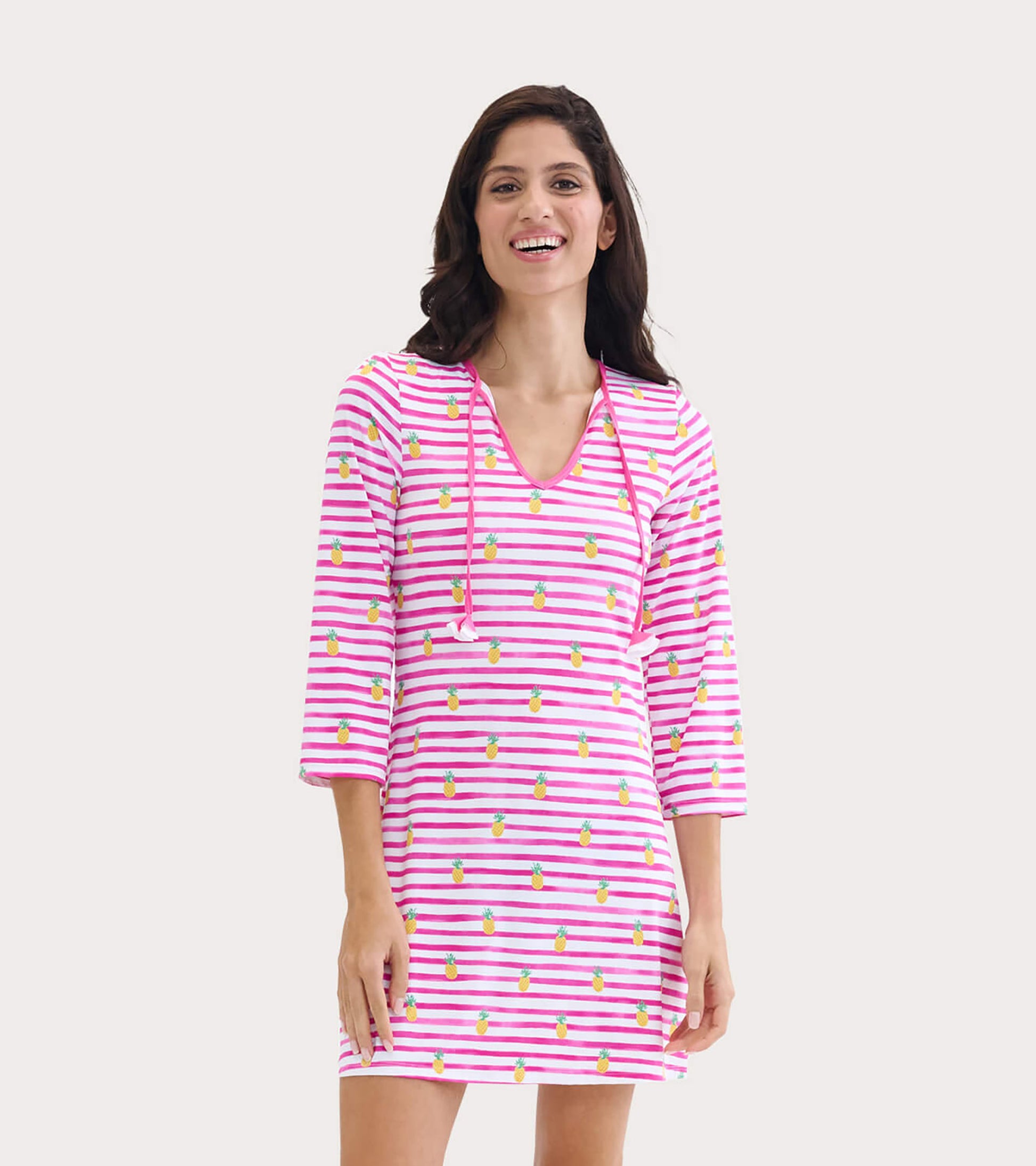 Pink and white striped beach dress with pineapple pattern, featuring a V-neck and three-quarter sleeves.