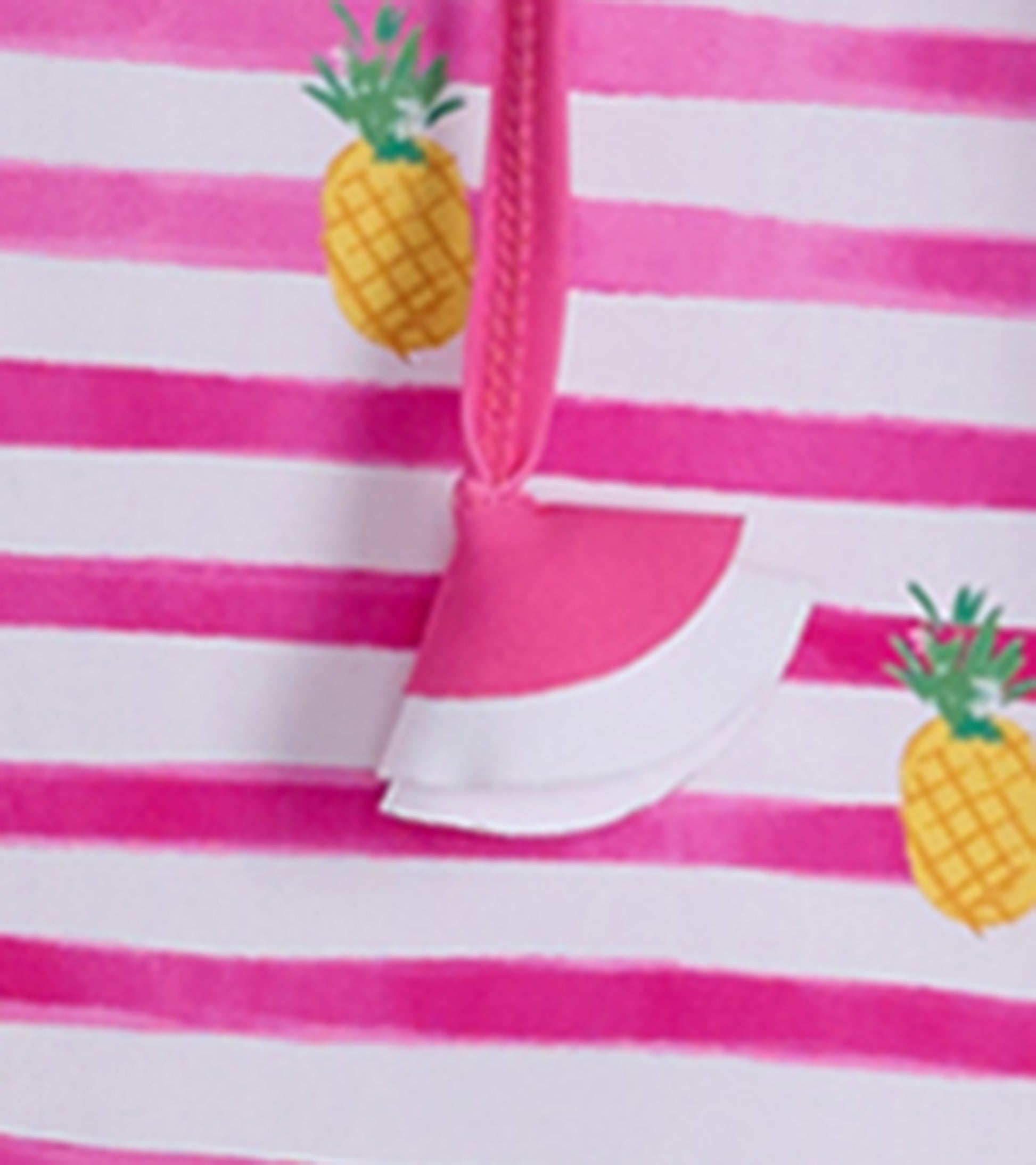 Pink and white striped beach dress featuring pineapple prints and a ruffled hem detail. Ideal for seaside wear.