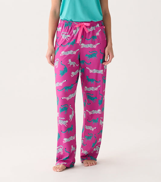 Pink pajama pants featuring a cheetah print in white and teal, with an elastic waistband and drawstring.