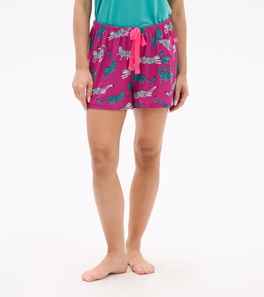 Pink pajama shorts featuring a cheetah print, elastic waistband with a drawstring, and a relaxed fit.