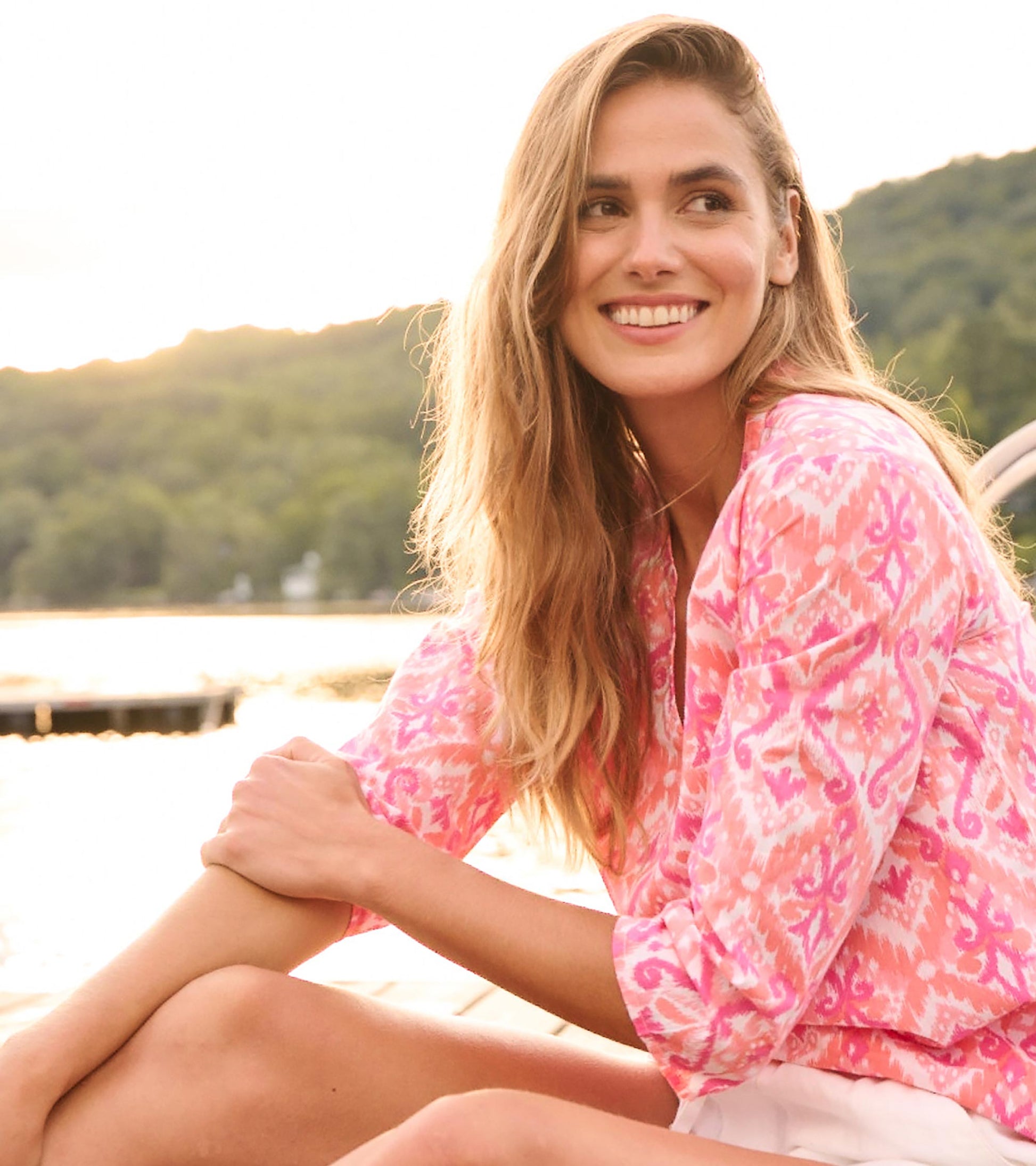 Pink and white ikat-patterned tunic with long sleeves, perfect for casual beach outings.