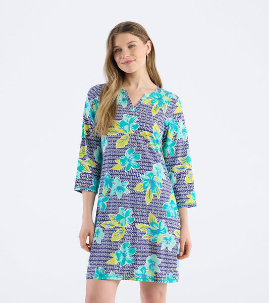Short-sleeve dress featuring a bold floral pattern in turquoise and yellow on a navy background, with a notch neck design.
